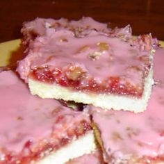 several pieces of cake sitting on top of a yellow plate