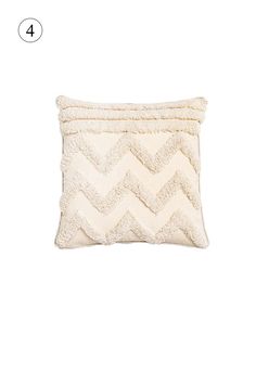 a white pillow with a chevron pattern on the front and back, sitting on a white background