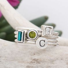 "Looking for a last minute gift? We are shipping same day or next day right now! This is an Etsy Bestseller and sure to be a hit when the gift is opened. Stack rings make the perfect Mother's Ring designed by you! Create a ring with as many stacked birthstone and initial bands you need to represent those you love. You can mix and match, stack and spell! Say whatever you want with these stackable Initial rings. Spell a child's name, stack your initials, or get one initial and birthstone for each Adjustable Stackable Initial Ring As Gift, Minimalist Stacked Rings Gift, Minimalist Stacked Rings As Gift, Modern Adjustable Stackable Rings As A Gift, Modern Adjustable Stackable Rings For Gifts, Stacked Ring Jewelry Gift, Modern Personalized Adjustable Stackable Rings, Sterling Silver Stackable Rings, May Birthstone Gift, Silver Stackable Rings For May Birthstone