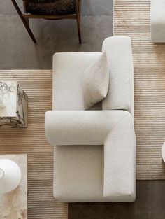 an overhead view of a living room with white furniture