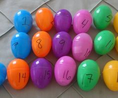 colorful balls with numbers on them sitting on the ground