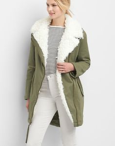 New with tags. Gap style 922500 Olive green with faux fur sherpa lining. Oversized fit. Cotton/spandex Size xsmall Apx: 30 1/2" long in the front, 36" in the back. 21 1/2" underarm to underarm. DETAILS Faux fur lined notch collar, asymmetrical zip front. Drawstring cord at waist. Flap slant pockets. Drawcord ties at hem, vent at back. PrimaLoft insulation International Buyers – Please Note: Import duties, taxes, and charges are not included in the item price or shipping cost. These charges are t Gap Style, Buy Coats, Army Jacket, Gap Jacket, Womens Parka, Notch Collar, Oversized Silhouette, Parka Jacket, Jackets Online