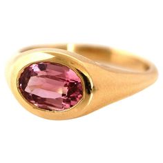 Introducing our 18ct Gold Gemstone Signet Ring, meticulously crafted by Master Goldsmiths in London. This exquisite ring features a stunning 1.48ct oval mixed cut pink tourmaline, this gemstone was ethically sourced from Malawi. The warm, rich tone of the 18ct gold setting perfectly complements the gemstone, creating a striking and timeless piece. Tourmalines are a symbol of peace and balance. Its vibrant pink hue makes it an attractive choice for anyone seeking emotional healing and wisdom. MEA Peace And Balance, Symbol Of Peace, Resize Ring, Daisy Ring, Signet Rings, Diamond Ring Settings, Modern Ring, Tourmaline Ring, Antique Diamond