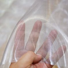 a person holding a plastic bag with their hand in it