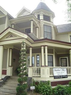 a large white house with columns and a sign on it's front porch that says medfer way