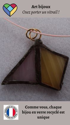 an image of a piece of glass on a string with the words art bijou