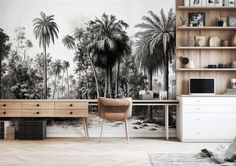 a room with a desk, shelves and wallpaper that has palm trees on it