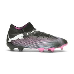 a soccer shoe with pink accents on the bottom and black soles, in front of a white background