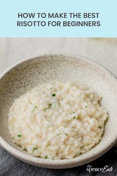 a white bowl filled with risoto rice on top of a table