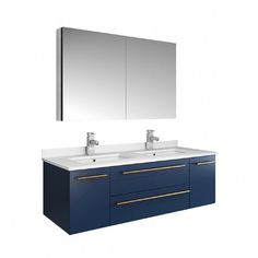 a bathroom vanity with two sinks and a mirror on the wall above it is shown