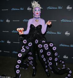 a woman dressed in an octopus costume poses for the camera