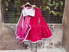 This is a made to order Lehenga Choli dupatta. I make it exclusively for my customers by using designer fabrics. Handling time, don't worry, just tell me, I will process it accordingly and deliver on or before a delivery date you mention. Fabric and Work: Lehenga made using in a hotpink velvet fabric. Mirrors are then pasted as handwork over lehenga. Blouse is made with white silk fabric having silver embroidery work. Dupatta is made in a matching color tone of lehenga. It has silver sequences and silver lace attached to it. One of my favourite outfit. Bridesmaid Bollywood Dupatta, Bollywood Style Lehenga Saree For Bridesmaid, Anarkali Bridesmaid Sets With Dupatta, Bollywood Style Bridesmaid Sets With Dupatta, Bollywood Bridesmaid Sets With Dupatta, Traditional Bridesmaid Lehenga With Zari Work, Anarkali Choli For Bridesmaid Festive Occasions, Festive Anarkali Choli For Bridesmaids, Festive Anarkali Bridesmaid Choli