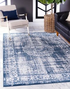 a blue and white rug in a living room