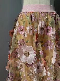 Crafted with precision and expertly embroidered flowers, this skirt adds a touch of whimsy to any outfit. The delicate details and unique design make it a must-have for any fashion-forward individual. - Color: Multicolor- Style: Skirt- Pattern Type: Floral- Waistline: High Waist- Length: Maxi- Closure Type: Elastic Waistand- Fabric: Polyester Fiber- Details: Embroidery- Fit Type: Flared- Occasion: Casual- Gender: Women- Size: S, M, L, XL SIZE CHART (cm) SIZE Waist Length S 64 80 M 68 82 L 84 84 Long Bandage Dress, Pleated Tulle Skirt, Elegant Bodycon Dress, Pleated Tulle, American Dress, High Waist Long Skirt, Fairy Skirt, Suspenders For Women, Sleeveless Shirt Dress