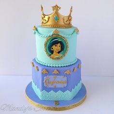 a three tiered cake with a princess on top