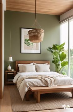 a bedroom with green walls and white linens on the bed, hanging basket over the headboard