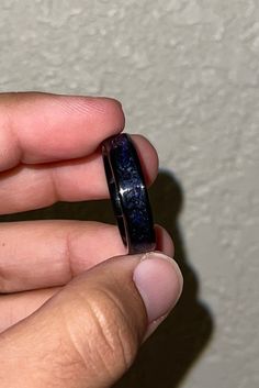 A Black ceramic ring featuring an black inlay along with Amethyst as the main and only stone inlayed. Amethyst is commonly transparent and so there is the use of purple coloring underneath the Amethyst to bring out its color a little more. A very subtle ring for those who prefer simplicity over flashy! The ring in the photos is a size 12.5 and has a width of 6 millimeters! You have the choice of widths from 4 millimeters, 6 millimeters, and 8 millimeters. Please be mindful the thinner the ring w Luxury Handmade Amethyst Ring Gift, Hand Forged Amethyst Ring As Gift, Luxury Handmade Amethyst Gift Ring, Handmade Purple Amethyst Crystal Ring, Luxury Handmade Spiritual Amethyst Ring, White Opal Ring, Opal Band, Ceramic Ring, Grand Prairie