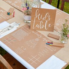 a table set up with place cards and napkins for guests to use on their wedding day