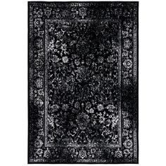 a black and white rug with an intricate design