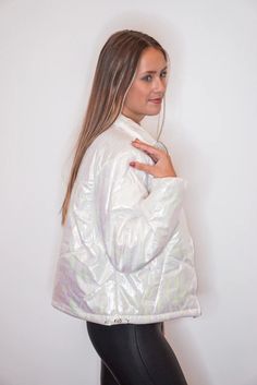 Metallic iridescent white puffer jacket This metallic puffer jacket is calling your name! Metallic iridescent white puffy fabric, featuring front zipper closure, high neckline when zipped all the way up, gathered elastic cuffed long sleeves, front pockets, and a drawstring bottom hemline that adjusts on each side. She's absolute perfection! Wear her with your fav boots or sneakers for a super cute and cozy outfit! Fits true to size Model is 5’6” wearing a small Fabric doesn't contain stretch Zip Metallic Puffer Jacket, Jacket For Winter, White Puffer Jacket, White Puffer, Iridescent White, Winter Styles, Vintage Couture, Vintage Havana, Clothing Logo