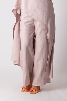 Two Pieces Linen Set. Elegant tunic with Wide Legs Pants. The pants have elastic waist band and 2 sides pockets. The tunic is asymmetric, with a short front and a long back reaching down to the ankle. Top and bottom can be worn separately and combined with various clothes successfully. Made of 100% linen The model wears size M - 5′6″ / 170 cm Asymmetrical Hem Bottoms With Pockets For Spring, Spring Bottoms With Asymmetrical Hem And Pockets, Casual Pants With Asymmetrical Hem For Spring, Chic Baggy Bottoms With Asymmetrical Hem, Spring Cotton Pants With Asymmetrical Hem, Spring Loungewear Bottoms With Side Slits, Chic Cotton Bottoms With Asymmetrical Hem, Cotton Pants With Asymmetrical Hem For Spring, Spring Lagenlook Wide Leg Pants