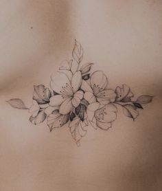 a woman's chest with flowers on it