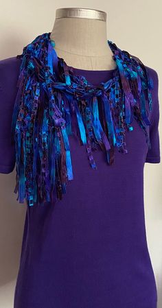 Purple  scarf for women. Gorgeous colors in purple, turquoise and royal blue ribbon with silver metallic. Customers are raving about the depth of the colors. You can arrange it many ways, this is not an infinity scarf and is very light to wear. Makes great travel accessory, just wrap it around your neck over some matching top and you are good to go for great evening out. Elegant pop of color for office attire or business suits.  Hand wash in lukewarm water with mild soap, don't rub or wring, squeeze off excess water and hang to dry. Cool iron is ok for the ribbon scarves if needed.  Comes with nice organza satchel for traveling or gift giving. I recommend storing the ribbon scarves on a hanger or flat in a drawer. Once you receive the scarf, please give it a gentle shake to straighten it o Unique Gifts For Girlfriend, Necklace Fancy, Turquoise Scarf, Scarf Art, Women Necktie, Necklace Scarf, Purple Accessories, Purple Scarf, Business Suits