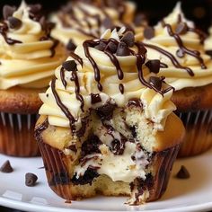 cupcakes with white frosting and chocolate chips on top