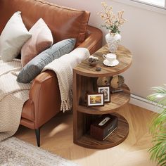 a living room with a couch, table and potted plant on the corner shelf