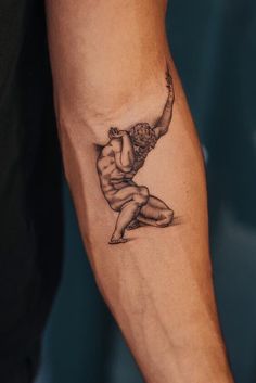 a person with a tattoo on their arm