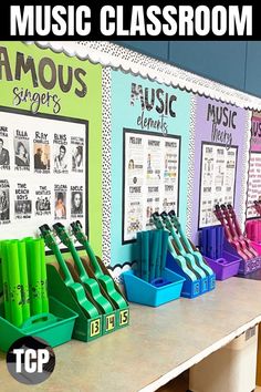 a classroom display with colorful plastic bins and music lessons on the wall behind it