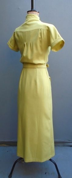 This replicated pattern is sized to fit a 36 inch bust/39 inch hip. This 1935 reproduction pattern features dress in two styles, gives a number of design options dating between 1933-1935. In View One the stand up collar and patch pockets show a stream-lined effect. A pleated insert at the center front skirt mirrors the narrow pleats at the center back of the bodice. In View Two, a traditional pointed collar and pockets are trimmed with narrow pleating. The center front skirt insert is softly sha 1930s Sewing Patterns, 1930s Clothes, 40s Outfits, Tea Gown, Simplicity Fashion, Pattern Sheet, Ladies Day Dresses, Fashion Forecasting, 1930s Fashion