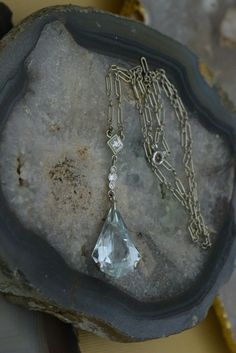 "18K White Gold Vintage 10 ct + Aquamarine teardrop with diamond accents, 16\" chain with a 2\" extension drop; Superb Aquamarine large 10 ct + in teardrop shape, highlighted with diamonds above central stone, Circa 1950, 6.9 grams. Stock # BB129N10 This listing contains photographs of the actual item you will receive. Our items are in excellent condition with little or no signs of wear and many are one of a kind pre-owned estate finds. Please look closely at the pictures in this listing as they Aquamarine Necklace, Fine Jewelry Designers, Yellow Gold Earring, Gold Coins, Earring Backs, Diamond Pendant, Aquamarine, Dog Tag Necklace, Gold Diamond