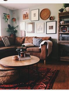 a living room filled with furniture and lots of pictures on the wall above it's coffee table