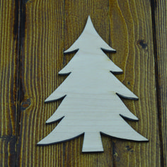 a wooden cutout of a white christmas tree