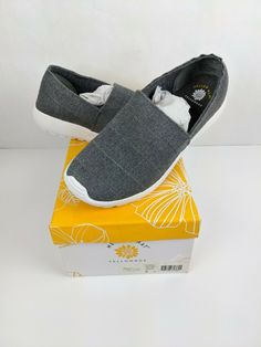 NEW in box Mellow Mat Yellow Box Voxy Shoe Color:  Gray Women's size:  8M  (my opinion:  they run small) Mellow Mat™ Call off the search, for you’ve found the sandals that provide style without sacrificing comfort! Discover a comfort-focused Yellow Box Mellow Mat™ EVA dual-density sandal collection. The bouncy, shock-absorbing Mellow Mat™ is inspired by the yoga mat material and it shapes to your feet. The Yellow Box Mellow Mat™ Collection includ Mellow Mat, Yellow Box Shoes, Sandals Flats, Box Shoes, Grey Women, Yoga Mat, The Search, Slip On Sneaker, Baby Shoes