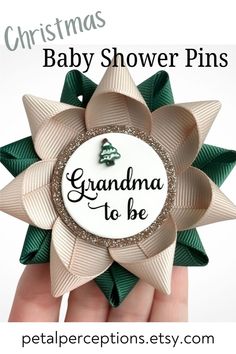 a baby shower pin with the words grandma to be on it and a christmas tree