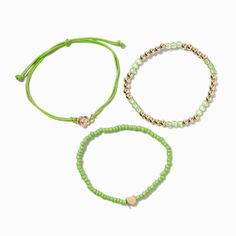 Stack these bracelets on your wrist for inspiration! The three-pack set includes a gold-tone beaded stretch bracelet, a lime green beaded stretch bracelet with a gold-tone heart, and a lime green adjustable bracelet with a gold-tone flower. Pack Size: 3Closure: Stretch fit, BoloMaterial: Plastic, Polyester, Metal - Claire's Lime Green ''Grow'' Inspiration Beaded Bracelet Set - 3 Pack Piercing Kit, Seed Bead Bracelet, Fashionable Jewelry, Demi Fine Jewelry, Seed Bead Bracelets, Beaded Stretch Bracelet, Metal Style, Adjustable Bracelet, Bracelet Patterns