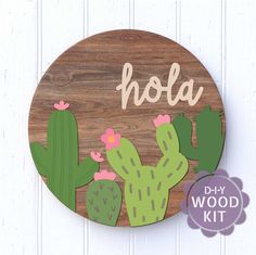 a wooden sign that says hola with cactus and flowers