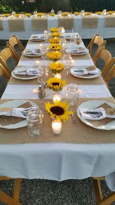 an image of a table setting with sunflowers