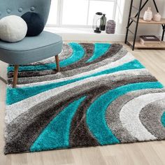 a blue and gray rug in a living room