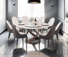 a dining room table with chairs around it