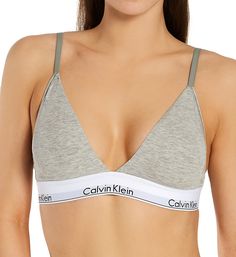 Soft cotton-blend knit bra comes with optional pads for smooth coverage. Wireless triangle-style cups are seamless and lined with same fabric to create pockets for removable padding, included. Plunge neckline has covered elastic at the edges to keep fit close. Soft Calvin Klein logo elastic underband secures hold and light support. Sides and back are cotton blend with covered elastic at the upper edge and underband below. Extra soft elastic straps have highly restricted stretch and fully adjust Calvin Klein Panties, Cotton Sports Bra, Intimo Calvin Klein, Calvin Klein Bra, Cotton Bras, Triangle Bralette, Garment Labels, Triangle Bra, Calvin Klein Woman