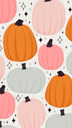 a pattern with pumpkins and stars on white background for wallpaper or fabric design