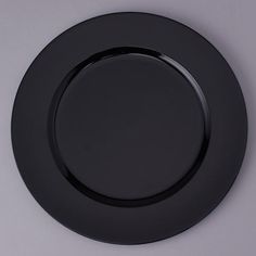 the black plate is empty and ready to be used for dinner or other special occasion