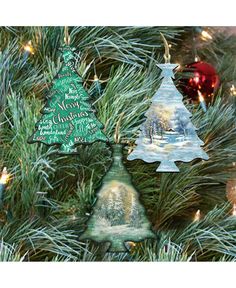 three christmas ornaments hanging from a tree