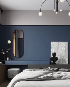 a bedroom with blue walls and white sheets on the bed, along with an art piece