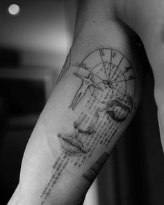 a person with a clock and face tattoo on their arm