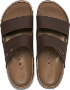 Brown Synthetic Slide Sport Sandals, Comfortable Slides With Ortholite Insole For The Beach, Beach Slides With Ortholite Insole And Open Toe, Ortholite Slide Sport Sandals For Vacation, Casual Footbed Sandals With Ortholite Insole For The Beach, Beach Season Sport Sandals With Removable Insole, Brown Summer Surfing Sandals, Brown Summer Sandals For Surfing, Brown Synthetic Slides For Beach