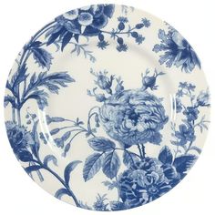 a blue and white plate with flowers on it